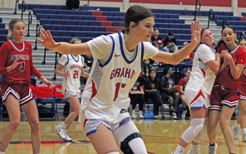 (ALEX HAVARDANSKY | THE GRAHAM LEADER) Tara Dawson plays up on defense Tuesday, Dec. 16 against the Memorial Lady Mavericks. Dawson scored six points in the Lady Blues 52-41 win over the Lady Mavericks. 