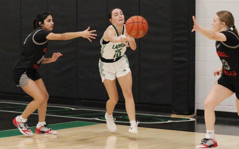 (ALEX HAVARDANSKY | THE GRAHAM LEADER) Rae’Lynn Bennett passes the ball to a teammate Thursday, Dec. 18 against the Mineral Wells Lady Rams. The Ladycats will pick things up Tuesday, Dec. 30 against Baird on the road. 