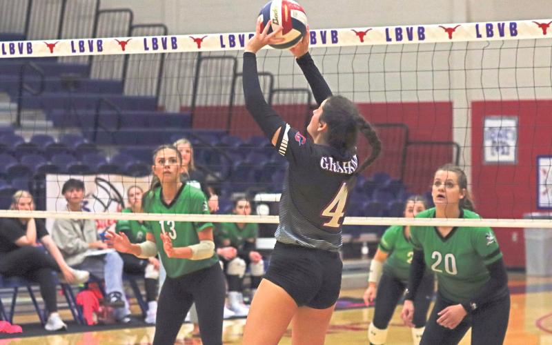 (ARCHIVE PHOTO | THE GRAHAM LEADER) Graham senior Georgia Martin sets a ball for one of her teammates to score during the team’s 3-0 win over Iowa Park in September 2024. The senior made her season debut after missing nearly the entire first month of the season with an injury.