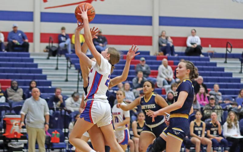 (THOMAS WALLNER | THE GRAHAM LEADER) Katelyn McGeehee takes flight to attempt a  2-point shot  for the Lady Blues in their Tuesday, Jan. 7 matchup against the Stephenville Honeybees. McGeehee was one of the top scorers for the team during the game which ended in a 57-31 loss.