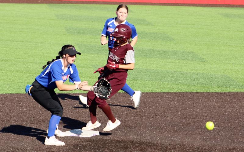 (ALEX HAVARDANSKY | THE GRAHAM LEADER) Hannah Mason covers second on a pickoff attempt Tuesday, April 15. The Lady Blues beat the Lady Lions 10-6 in the matchup.