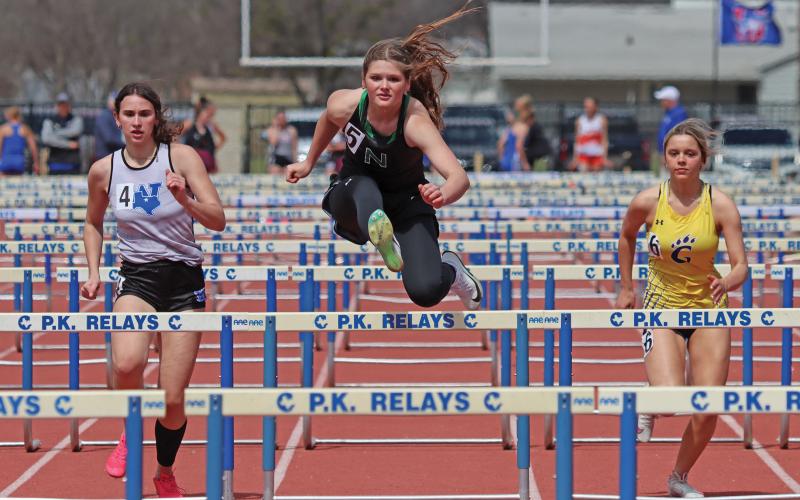 (THOMAS WALLNER | THE GRAHAM LEADER) Ladycat Camren Mallory competes in the 100 Meter Hurdles event at the 77th annual PK Relays held Saturday, March 15. Mallory came in second in the event with a time of 17.66.