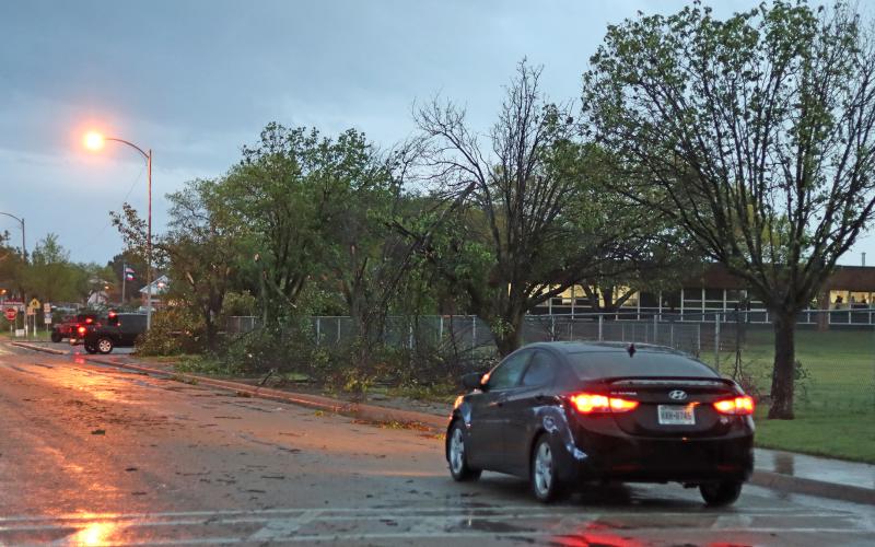(THOMAS WALLNER | THE GRAHAM LEADER) Trees down Cliff Drive near Woodland Elementary School that were impacted by a storm that blew through the area Thursday, April 3.