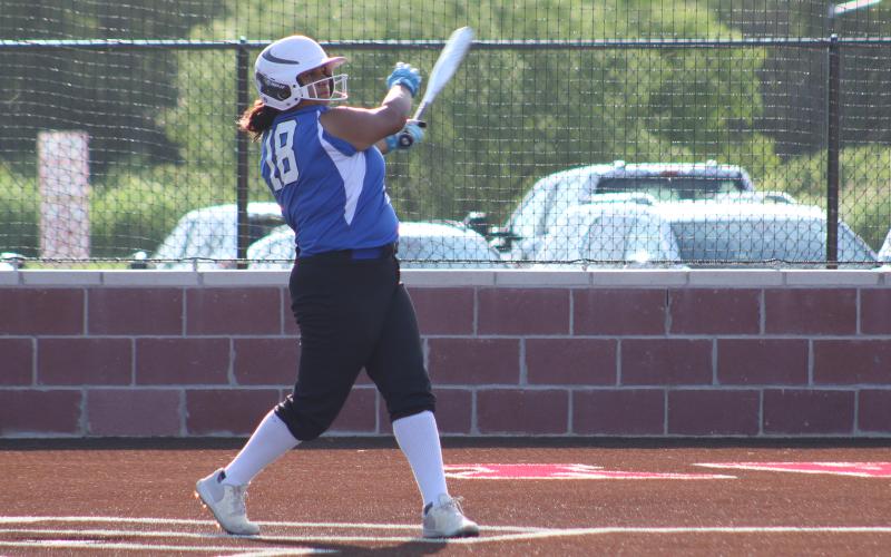 (ALEX HAVARDANSKY | THE GRAHAM LEADER) Gabriella Reyes takes a swing at a ball Wednesday, June 18 for the Lady Blues. Reyes also played a new position in the outfield.