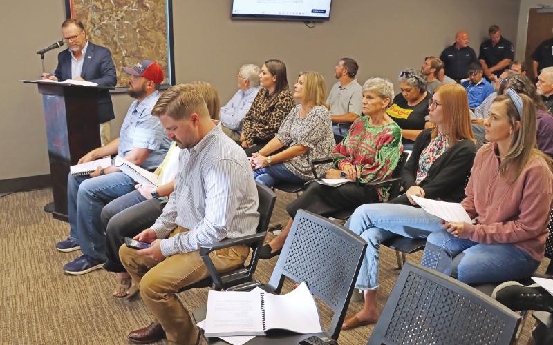 (THOMAS WALLNER | THE GRAHAM LEADER) City Manager Eric Garretty (at podium) gives a presentation on the upcoming fiscal year budget before a public hearing Thursday, Aug. 15. After a third reading Thursday, Aug. 29 the Graham City Council adopted the budget.