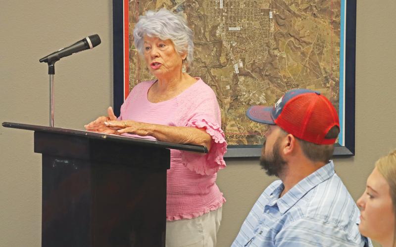 (THOMAS WALLNER | THE GRAHAM LEADER) Carol Willis speaks during a public hearing Thursday, Aug. 15 regarding the proposed fiscal year 2024-2025 budget. Willis was advocating for those on a fixed income and said the proposed increases were not something they could afford.