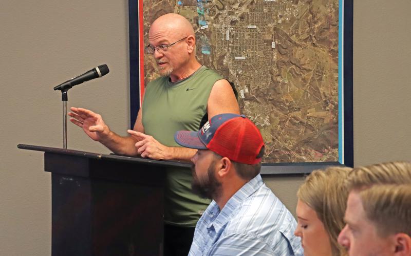 (THOMAS WALLNER | THE GRAHAM LEADER) Greg Bonzelaar speaks at the public hearing Thursday, Aug. 15 regarding the increases to sewer connection charges, water tapping fees and wastewater and water service charges. Bonzelaar had concerns about the cost for retaining engineering services.