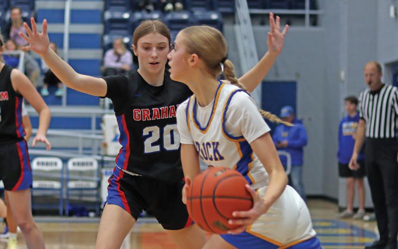 (ARCHIVE PHOTO | THE GRAHAM LEADER) Katy McGehee plays man to man defense on a player with the ball in one of the Lady Blues’ regular season games in 2024.