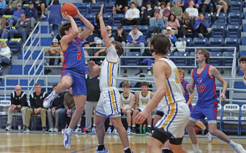 (THOMAS WALLNER | THE GRAHAM LEADER)  Bryce Martin jumps for a 2-point shot for the Steers in their district opener Saturday, Jan. 11 against Brock. The Graham team made key plays across the court but fell 89-28.