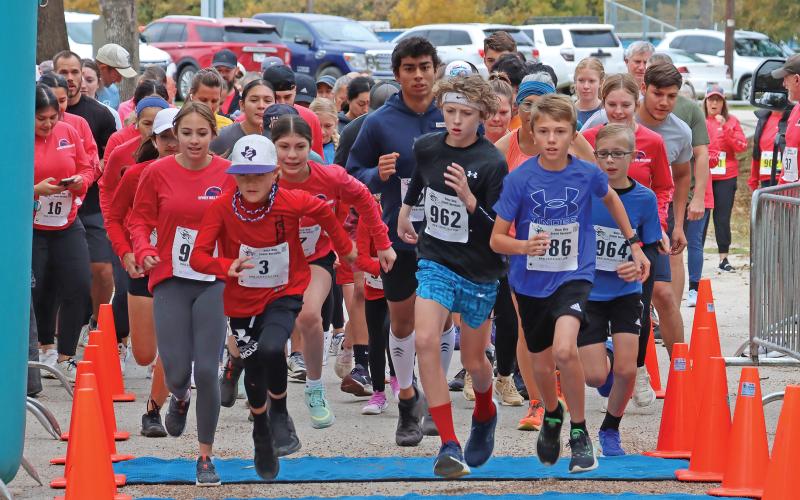 (ARCHIVE PHOTO | THE GRAHAM LEADER) A group of 5K runners take off from the starting line at the Spivey Hill Challenge at Firemen’s Park in 2023. The event this year will be held Saturday, Nov. 9 with registration available online.