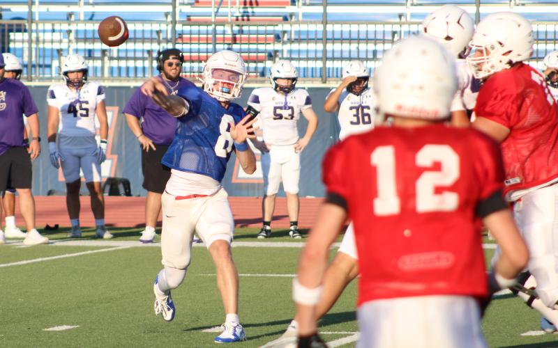 (ALEX HAVARDANKSY | THE GRAHAM LEADER) Jace Gill throws a screen pass Thursday, Aug. 21, against Godley. Gill will look to lead the Steers coming into this year.