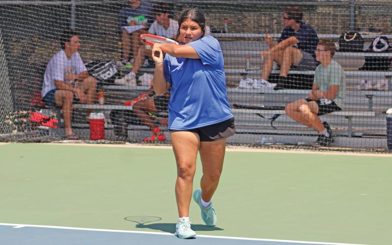 (ALEX HAVARDANSKY | THE GRAHAM LEADER) Jade Dospapas follows through on a two handed swing in her singles match Wednesday, Aug. 6. Dospapas along with Kline Krupp picked up the only girls doubles win for the Lady Blues and she had her most dominant singles win of the season so far in an 8-0 shutout. 