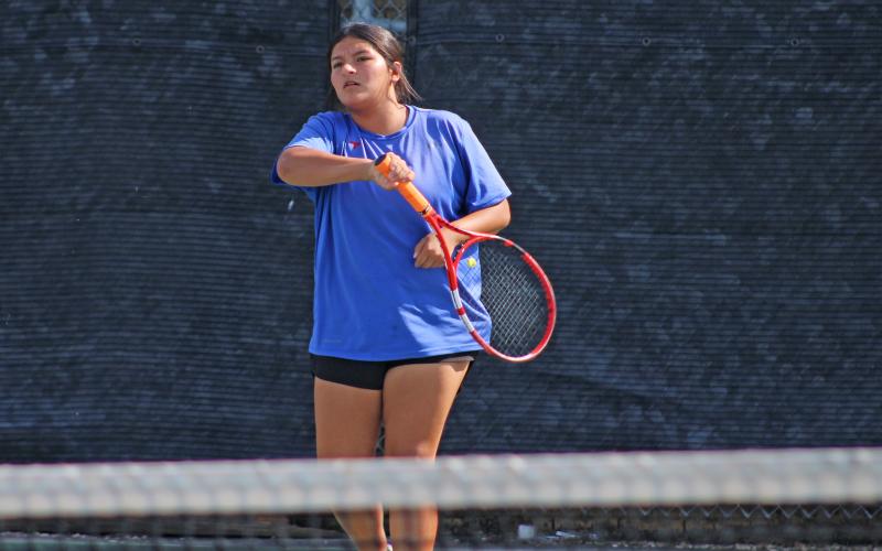 (ALEX HAVARDANKSY | THE GRAHAM LEADER) Jade Dospapas swings at a ball in her singles match. The Lady Blues took on Holliday during a meet Tuesday, Sept. 30, and Dospapas won her singles match 8-3.