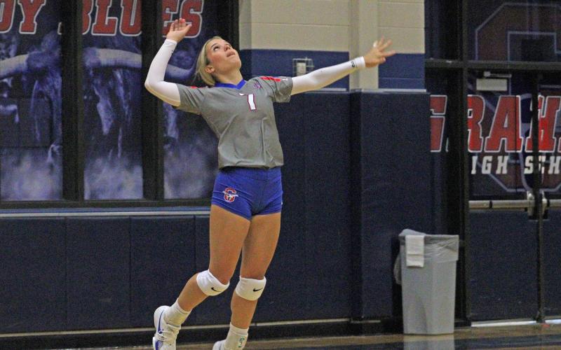(ALEX HAVARDANKSY | THE GRAHAM LEADER) Kaden Atwood goes up for a serve Friday, Sept. 5. Atwood had four aces in a five set victory over Iowa Park.