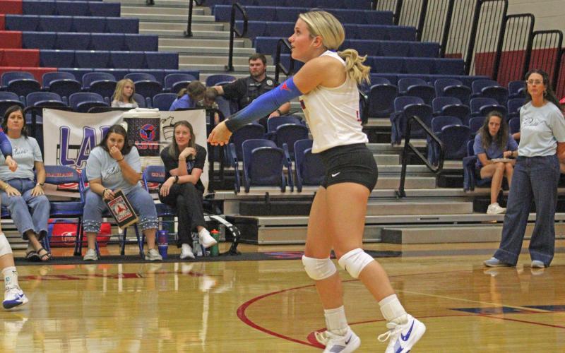 (ALEX HAVARDANSKY | THE GRAHAM LEADER) Kaden Atwood sets a ball for the Lady Blues in a previous match. Atwood continued to hold down the fort defensively for the Lady Blues against Memorial High School with 12 digs.
