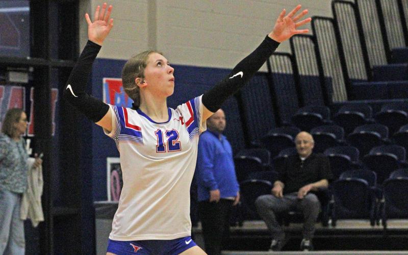 (ALEX HAVARDANKSY | THE GRAHAM LEADER) Kate Hufstedler throws the ball up for a serve Tuesday, Oct. 21 against the Brock Lady Eagles. Hufstedler helped keep the team competitive in set one with multiple points at the service line. 
