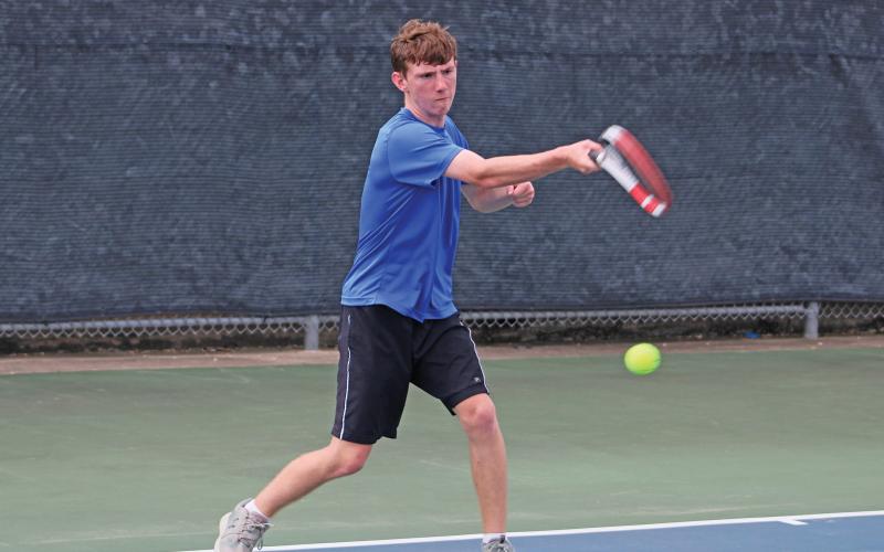 (ALEX HAVARDANSKY | THE GRAHAM LEADER) Keigan Garland swings at a ball during his singles match Friday, Aug. 1. Garland was one of three Steers to pick up a singles win against Azle. 