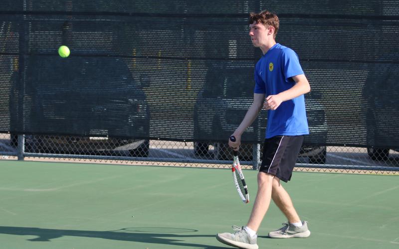 (ALEX HAVARDANKSY | THE GRAHAM LEADER) Keigan Garland gets set on a ball in a singles match. Garland alongside Jade Dospapas picked up the lone wins for Graham against Iowa Park.