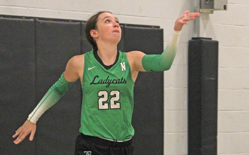 (ALEX HAVARDANSKY | THE GRAHAM LEADER) Kinzee Forbus throws the ball up for a serve Tuesday, Sept. 16, against the Gold-Burg Lady Bears. Forbus was effective at the service line in the Ladycats three-set win.