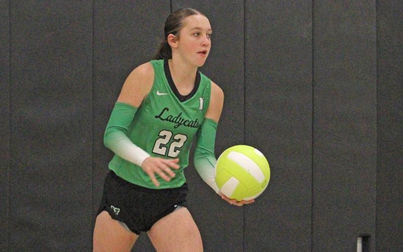 (ALEX HAVARDANSKY | THE GRAHAM LEADER) Kinzee Forbus prepares to throw the ball up for a serve in one of the Ladycats matches. Forbus had six kills in Newcastle’s win over Bryson which took place Saturday, Oct. 4.