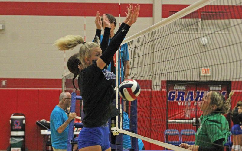 (ALEX HAVARDANSKY | THE GRAHAM LEADER) Kya Cooper (Front) and Tara Dawson (Back) go up for a black Saturday, Aug. 9. Cooper has been predominantly a setter and defender while Dawson has been another attacker on the corners of the net. 