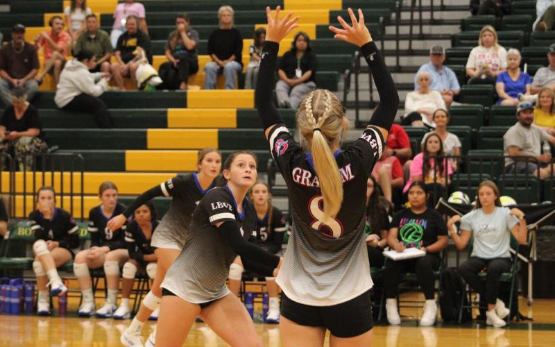 (ALEX HAVARDANSKY | THE GRAHAM LEADER) Kya Cooper sets up a pass Tuesday, Aug. 26, against the Lady Jackets. Cooper has solidified herself as a primary setter on the team.