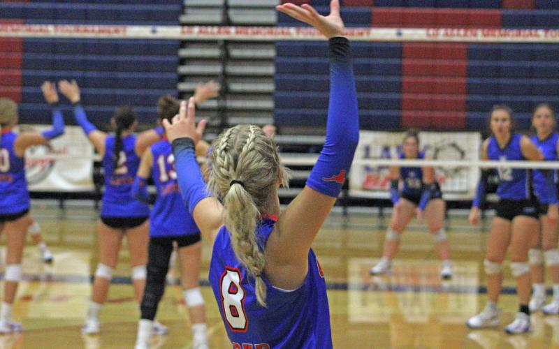 (ALEX HAVARDANSKY | THE GRAHAM LEADER) Kya Cooper sets up for a serve Saturday, Aug. 23, at the Lu Allen Memorial Volleyball Tournament. Cooper’s efforts at the service line helped the team pick up third place in the tournament.