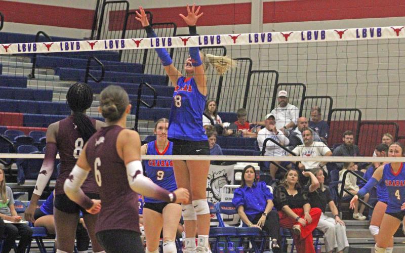 (ALEX HARVADANSKY | THE GRAHAM LEADER) Kya Cooper goes up for a block against the Brownwood Lady Lions in their match Tuesday, Sept. 23. Cooper’s tip points at the end of set four helped the Lady Blues pick up a thrilling victory.