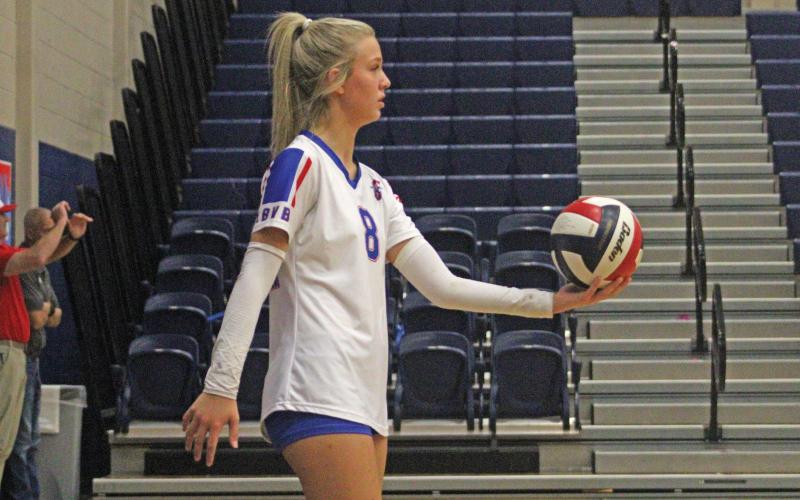 (ALEX HAVARDANSKY | THE GRAHAM LEADER) Kya Cooper holds the ball up prepping for a serve attempt Friday, Sept. 26. Cooper facilitated on offense with 12 assists against the Glen Rose Lady Tigers. 
