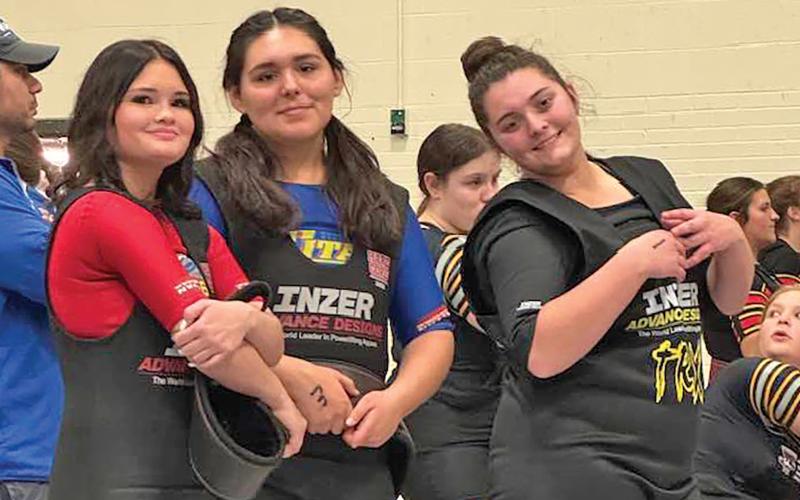 (GRAHAM HIGH SCHOOL | CONTRIBUTED PHOTO) Three Lady Blues competitors traveled Tuesday, Feb. 25 to compete in the regional powerlifting competition in Decatur. Shown from left to right are Lady Blues lifters Hope Jones, Hailey Martinez and Laney Herring during the qualifying meet Thursday, Feb. 13 in Weatherford.