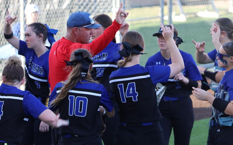 (THOMAS WALLNER | THE GRAHAM LEADER) Lady Blues coach Adam Arrington talks to his team between innings Tuesday, March 24, during the Lady Blues’ 11-1 loss to Brock. 