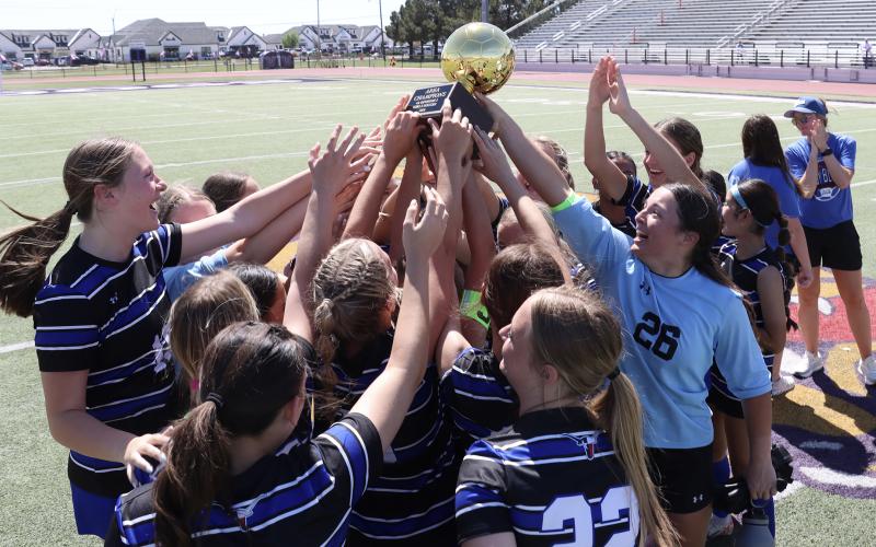 (THOMAS WALLNER | THE GRAHAM LEADER) Adi Pinkston runs the ball away from the Lady Blues’ side of the field during the area playoffs held Tuesday, March 24. The team came away with a historic 1-0 win over the Lubbock-Cooper Liberty Lady Patriots.