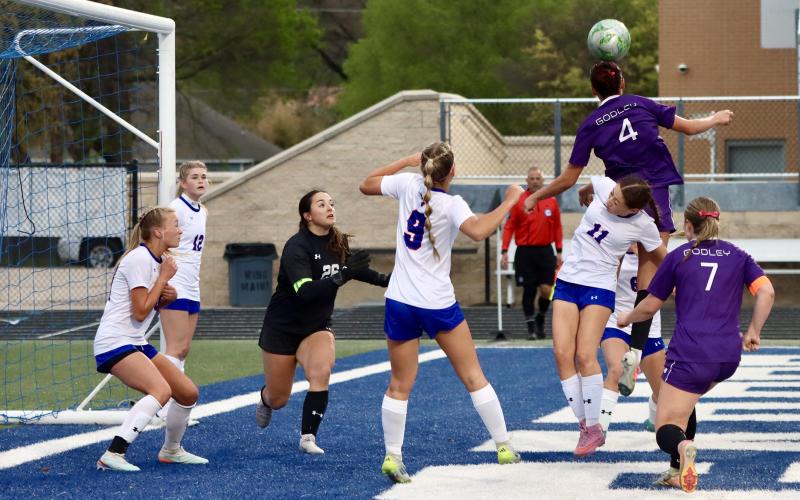 (THOMAS WALLNER | THE GRAHAM LEADER) Lady Blues defend the goal during the regional semifinal game held Friday, March 27 in Weatherford.