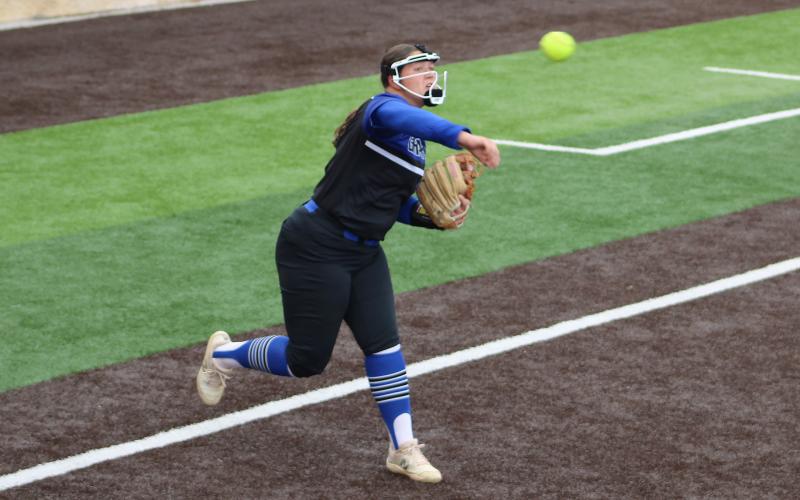 (ALEX HAVARDANSKY | THE GRAHAM LEADER) Hudson Wright throws to first in the Lady Blues hometown tournament. Wright has been a regular third baseman for the Lady Blues this season. 