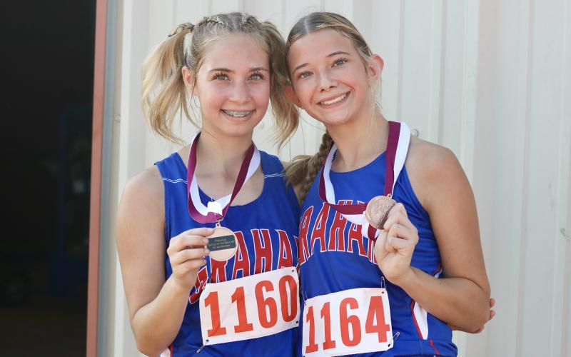(KYLIE BAILEY | THE GRAHAM LEADER) Maddison Bishop (left) and Taylan Locker came home with medals after the Battle of the Back 40 in Poolville. Locker finished 13th in the while Bishop finished 16th at the event Wednesday, Sept. 17. 