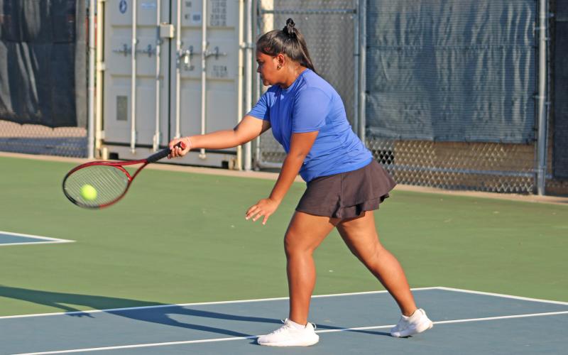 (ALEX HAVARDANSKY | THE GRAHAM LEADER) Manjot Humpal returns a ball during a singles match. Humpal was one of six Lady Blues to pick up a match win Thursday, Aug. 21 against Glen Rose.