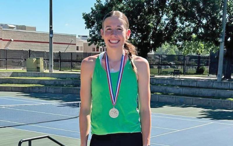 (NEWCASTLE ISD | CONTRIBUTED PHOTO) Newcastle’s Mattie Dollar with her medal for being the girls runner up in the regional tennis tournament in North Richland Hills. For qualifying for the championship match, Dollar punched her ticket to Dodd City for the state tournament Thursday, May 15. 