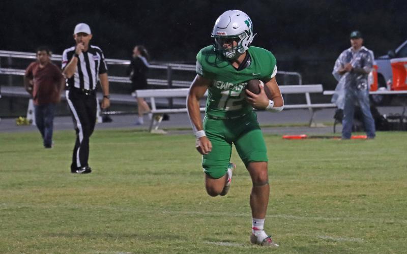 (THOMAS WALLNER | THE GRAHAM LEADER) Mikey Soito runs away from defenders for the Newcastle Bobcats. Soito is a veteran presence for the Bobcats as a senior on the team.