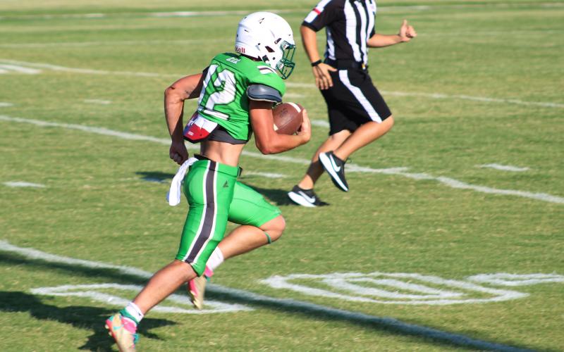 (ALEX HAVARDANSKY | THE GRAHAM LEADER) Mikey Soito breaks free down field for a receiving touchdown Friday, Aug. 22. Soito produced three touchdowns on the day.