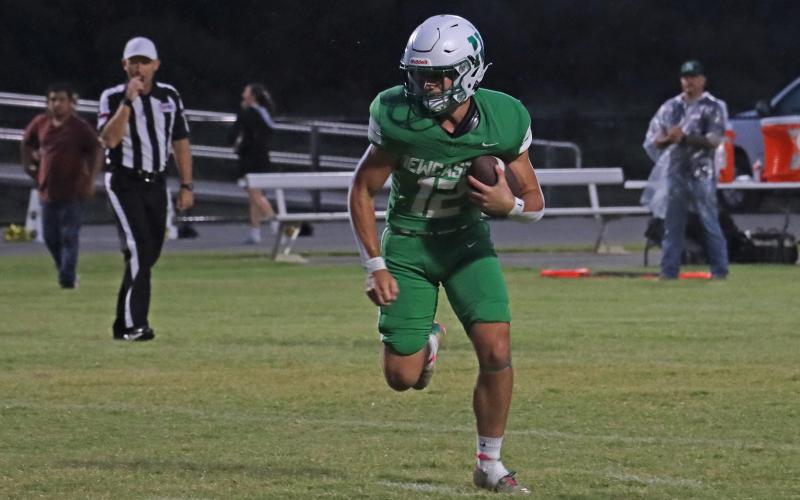 (THOMAS WALLNER | THE GRAHAM LEADER) Mikey Soito takes off with the ball for the Newcastle Bobcats. Soito recorded an interception return for a touchdown as well as a pick six.