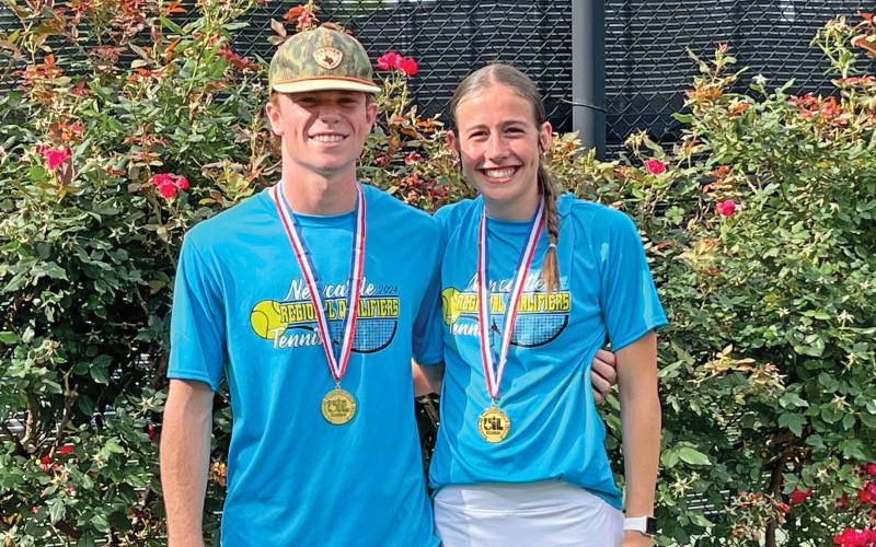 (ARCHIVE PHOTO | THE GRAHAM LEADER) Newcastle’s mixed doubles pair of senior Isaac King (left) and Mattie Dollar (right) with their regional championship medals they earned. The duo competed at the state tournament Thursday, May 16 but took a loss in their first match-up in three sets. 