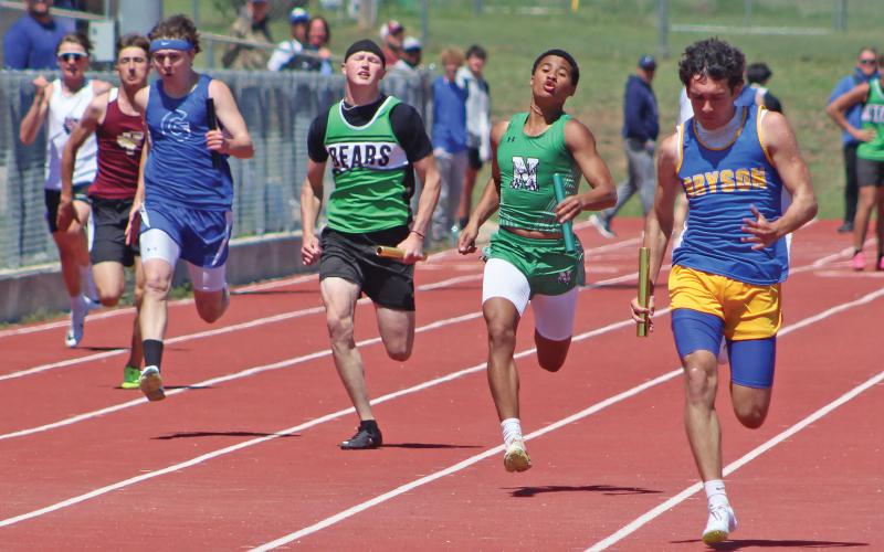 (BRIAN SMITH | JACKSBORO HERALD-GAZETTE) London Martinez of the Newcastle Bobcats track and field team competes in the relay event at their area meet Monday, April 7.