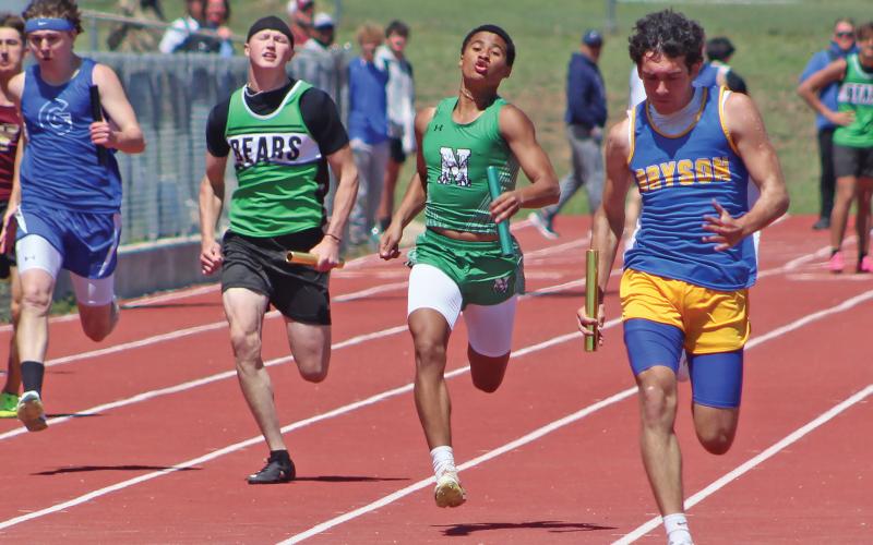 (BRIAN SMITH | JACKSBORO HERALD-GAZETTE) London Martinez of the Newcastle Bobcats track and field team competes in the relay event at their area meet Monday, April 7.