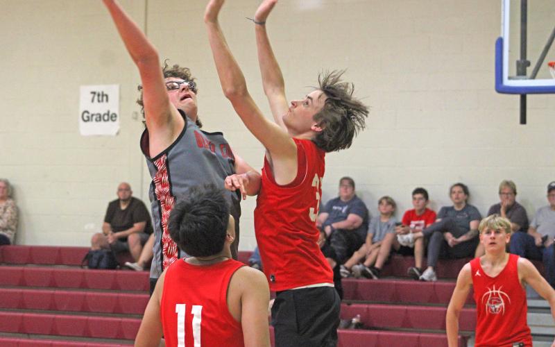 (ALEX HAVARDANSKY | THE GRAHAM LEADER) Nick Wankowicz jumps up to defend against a shot from Olney in their match Monday, Sept. 22. Wankowicz was pivotal for the Steers using his frame to box out defenders and create second chance opportunities offensively.