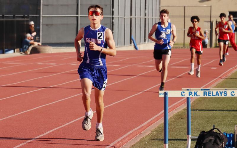 (THOMAS WALLNER | THE GRAHAM LEADER) Dayne Dunnam runs in the  3200-Meter Run for Small School 1A, 2A competition where he scored a fourth-place finish during the 78th annual PK Relays.