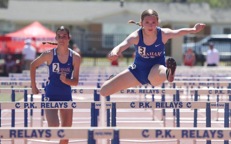 (KYLIE BAILEY | THE GRAHAM LEADER) Kate Hufstedler and Madison LeFevre compete in the 100-Meter Hurdles Big School 3A, 4A competition at the PK Relays held Saturday, March 21.