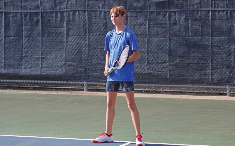 (ALEX HAVARDANSKY | THE GRAHAM LEADER) Raife Bishop stands ready to return a serve Saturday, Aug. 2. Bishop had the closest contest of any of the boys singles matches against Peaster, fighting hard in an 8-4 loss. 