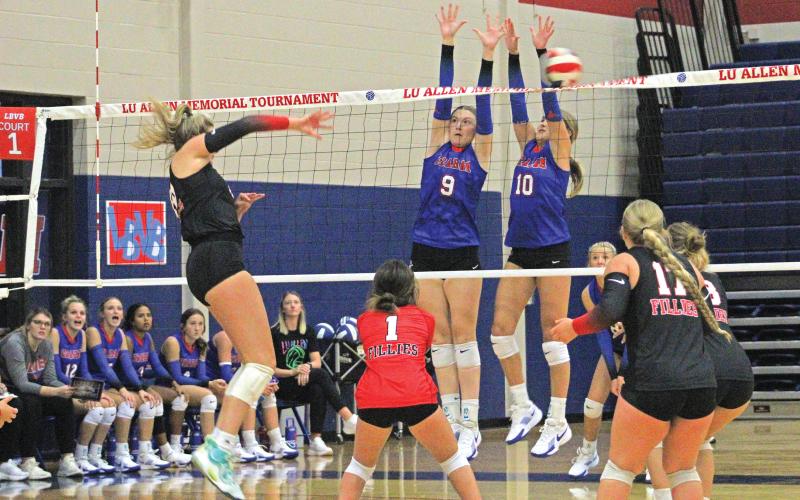 (ALEX HAVARDANSKY | THE GRAHAM LEADER) Rylee Moore (left) and Emily Hughes (right) go up for a block at the Lu Allen Tournament. Moore is one of the veteran leaders on the team and Hughes led the team in kills at the Denver City Tournament. 
