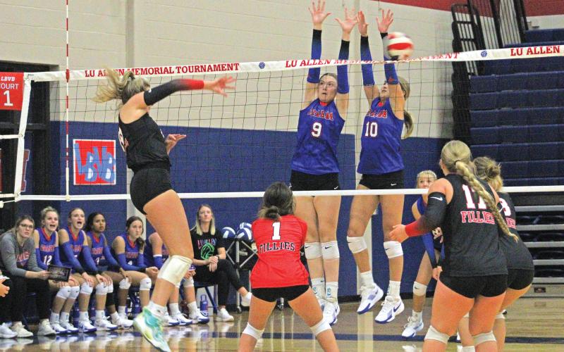 (ALEX HAVARDANSKY | THE GRAHAM LEADER) Rylee Moore (left) and Emily Hughes (right) go up for a block at the Lu Allen Tournament. Moore is one of the veteran leaders on the team. The Graham Leader is recognizing Moore as the week's Athelete of the Week.