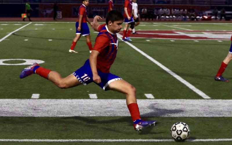 (KYLIE BAILEY | THE GRAHAM LEADER) Cason Walker winds up a kick down the field Friday, Feb. 13 against the Mineral Wells Rams. The Steers will look to make a late push in their district schedule after this matchup.